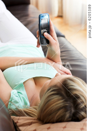 Beautiful woman using a phone 6205389