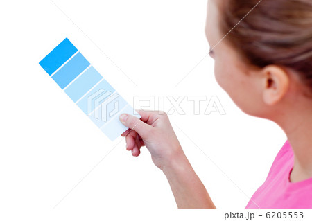 Caucasian woman choosing a color to decorate her house Caucasian woman choosing a color to decorate her house 6205553