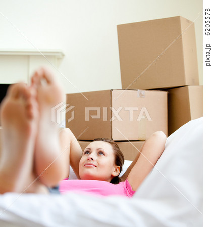Cute woman having a break between boxes Cute woman having a break between boxes 6205573