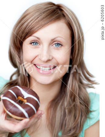 Delighted woman eating a cake 6205603