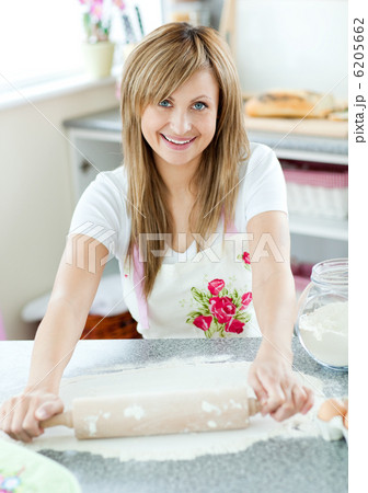 Attractive woman preparing a meal in the kitchen 6205662
