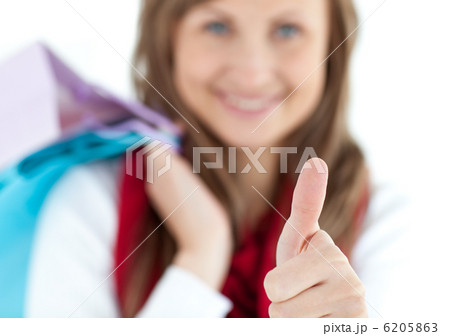 Pretty woman with a thumb-up 6205863