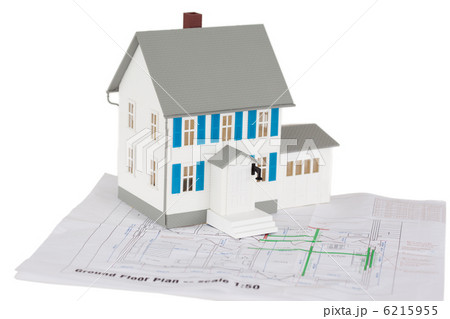 Gray toy house model on a ground floor plan Gray toy house model on a ground floor plan 6215955
