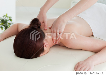 Close up of a young woman having a shoulder massage 6216754