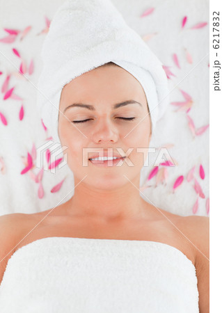 Beautiful brunette surrounded by petals Beautiful brunette surrounded by petals 6217832
