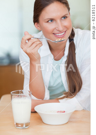 Portrait of a woman having breakfast 6218511