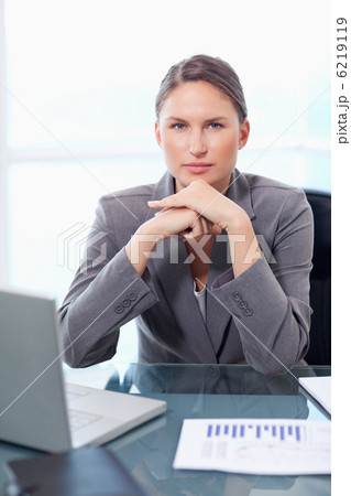 Portrait of a solemn businesswoman working 6219119