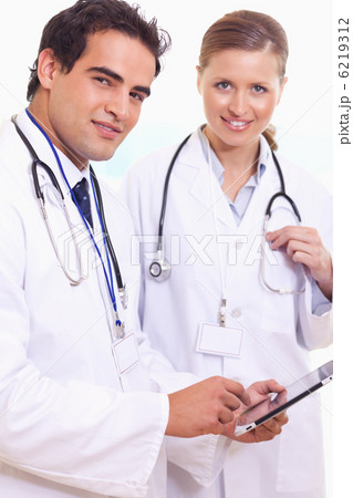 Assistant doctors with tablet Assistant doctors with tablet 6219312