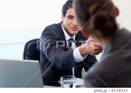 Satisfied manager interviewing a female applicant Satisfied manager interviewing a female applicant 6219323
