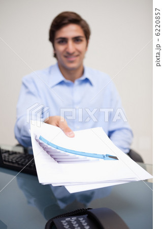 Statistics being handed over by businessman 6220857