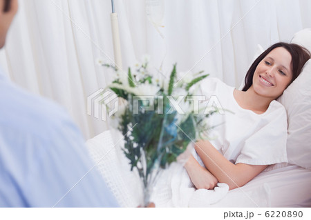 Female patient getting flowers Female patient getting flowers 6220890