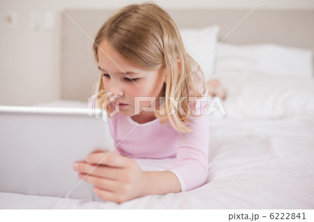 Little girl using a tablet computer Little girl using a tablet computer 6222841