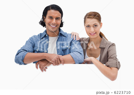 Couple leaning on blank wall Couple leaning on blank wall 6223710