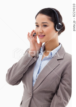 Portrait of a focused operator posing with a headset 6224010