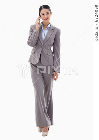 Portrait of a brunette businesswoman making a phone call Portrait of a brunette businesswoman making a phone call 6224099