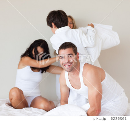 Laughing young man having fun with his family Laughing young man having fun with his family 6226361