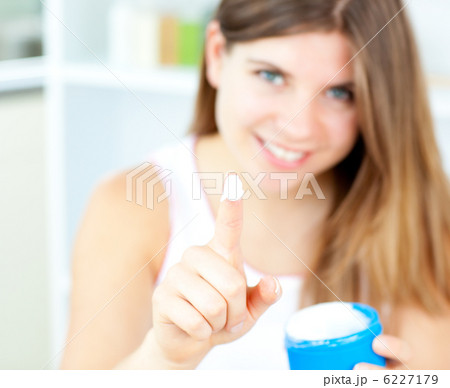 Pretty woman with cosmetic cream 6227179