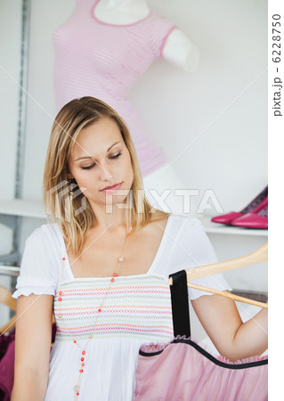 Cute women choosing new clothes Cute women choosing new clothes 6228750
