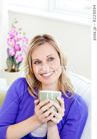 Charming woman holding cup 6229094