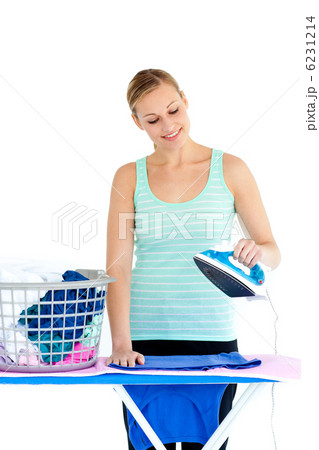 Bright woman ironing her clothes Bright woman ironing her clothes 6231214