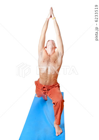 Yoga. Man in virabhadrasana position Yoga. Man in virabhadrasana position 6233519