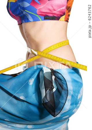 Woman measures waist 6243762
