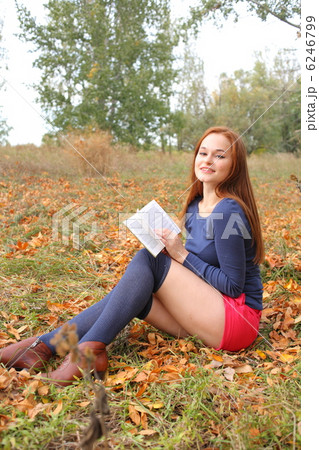beautiful girl holding an open book 6246799