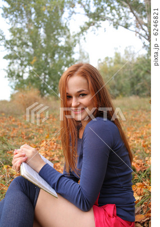 beautiful girl holding an open book 6246821