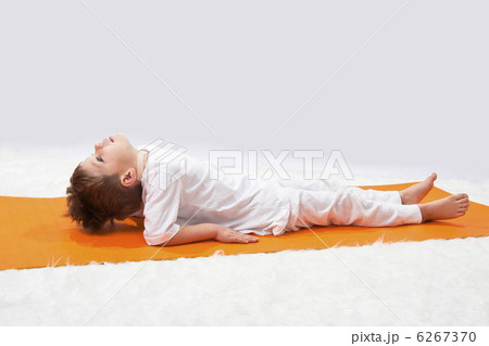 Children's yoga. The little boy does exercise. Children's yoga. The little boy does exercise. 6267370