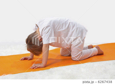 Children's yoga. The little boy does exercise. 6267438