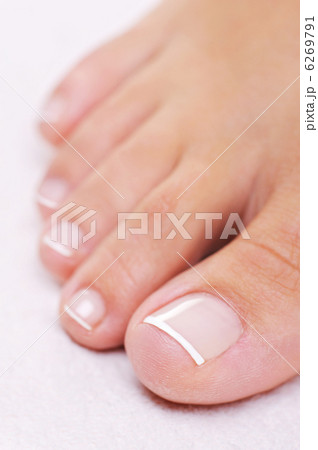 well-groomed female foot with a french pedicure 6269791