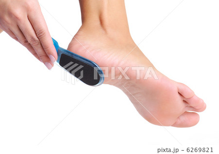 woman having her foot scrubbed 6269821