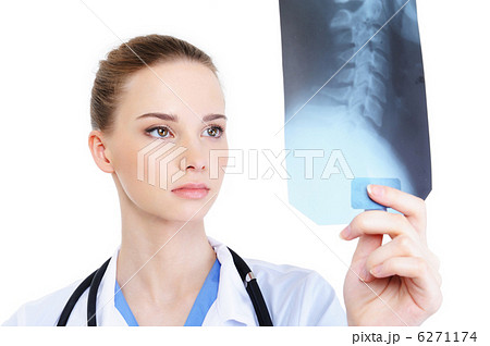 female practitioner looking at X-ray female practitioner looking at X-ray 6271174