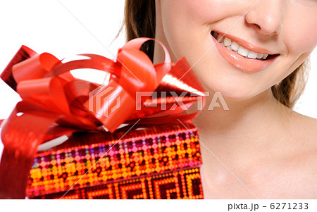 unrecognizable girl with a red present box on foreground 6271233
