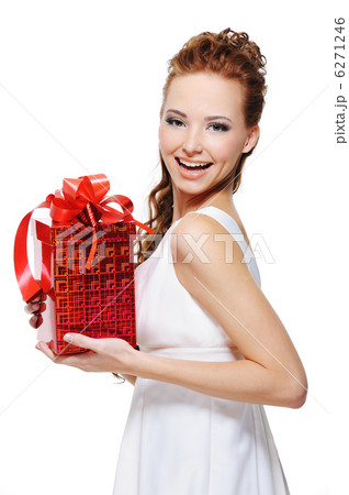 Pretty young laughing woman holding the gift Pretty young laughing woman holding the gift 6271246