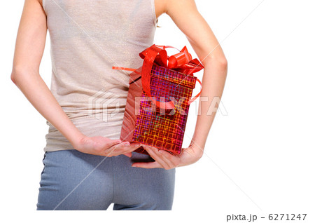 female person hide behind back the big present box 6271247