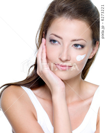 moisturizer cosmetic cream on female face 6273221