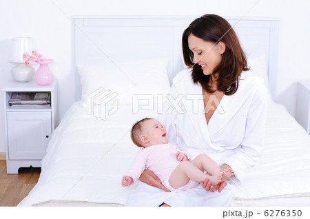 Mother with baby in bedroom Mother with baby in bedroom 6276350