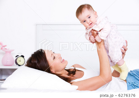 Mother playing with her baby 6276376