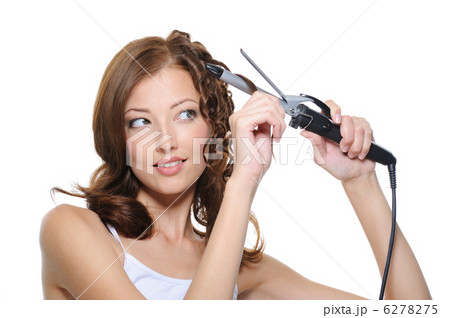 beautiful woman curling her health hair with roller beautiful woman curling her health hair with roller 6278275
