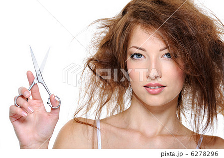 Female with backcombing hair and with scissors 6278296