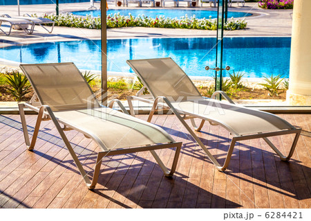 Sunbeds in the indoor swimming pool with views of the outdoor pool 6284421