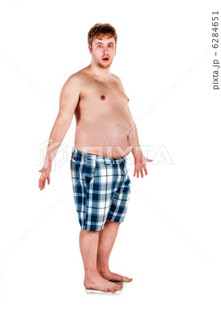 Overweight, fat man and scales. Overweight, fat man and scales. 6284651
