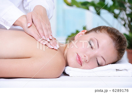 Woman getting back massage and relaxation 6289176