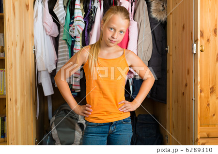 Family - child in front of her closet or wardrobe 6289310