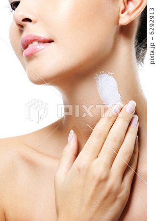Unrecognizable female apply cream on neck Unrecognizable female apply cream on neck 6292913