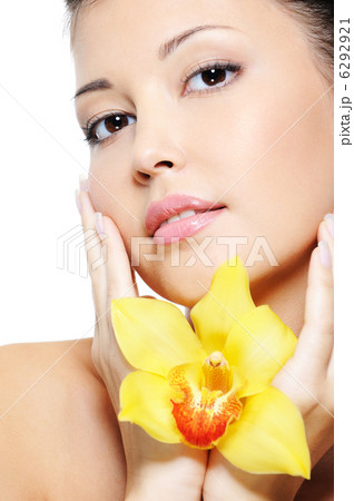 Attractive asian female face with flower 6292921