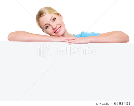 smiling blond girl under the white billboard 6293431