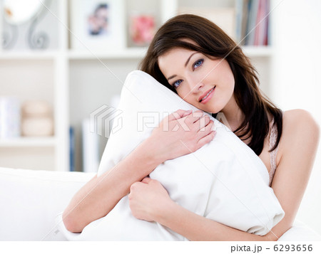 Woman with pillow at home 6293656