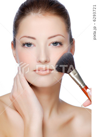 Woman doing makeup using brush - isolated white Woman doing makeup using brush - isolated white 6293721